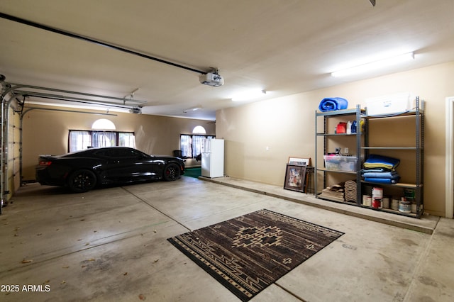 garage featuring a garage door opener