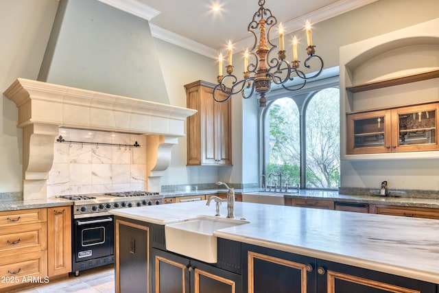 kitchen with tasteful backsplash, range with two ovens, custom range hood, ornamental molding, and sink