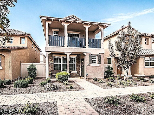 view of front of house with a balcony