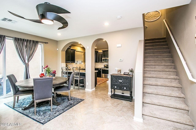 dining room featuring ceiling fan