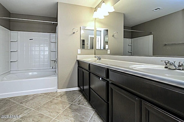 bathroom with tile patterned flooring, vanity, and shower / bath combination