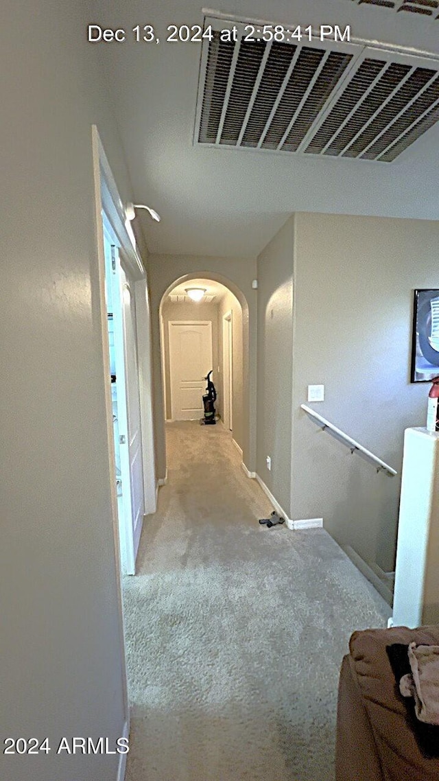 hallway with light carpet