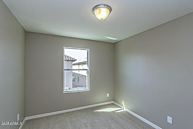 unfurnished room with carpet floors