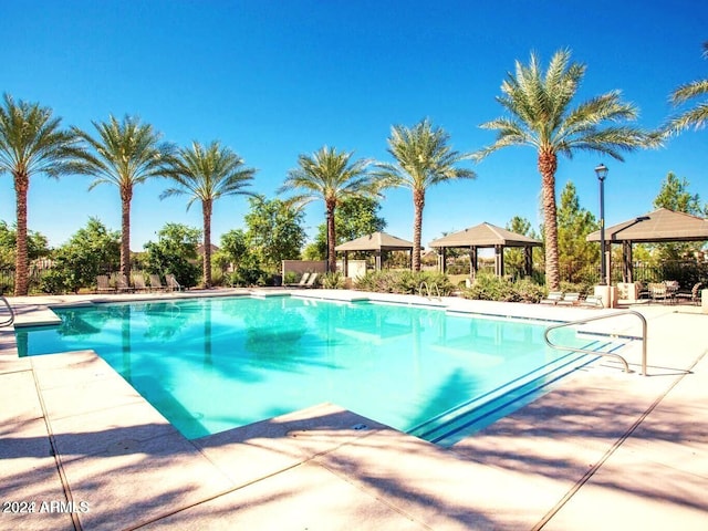 view of pool featuring a gazebo and a patio