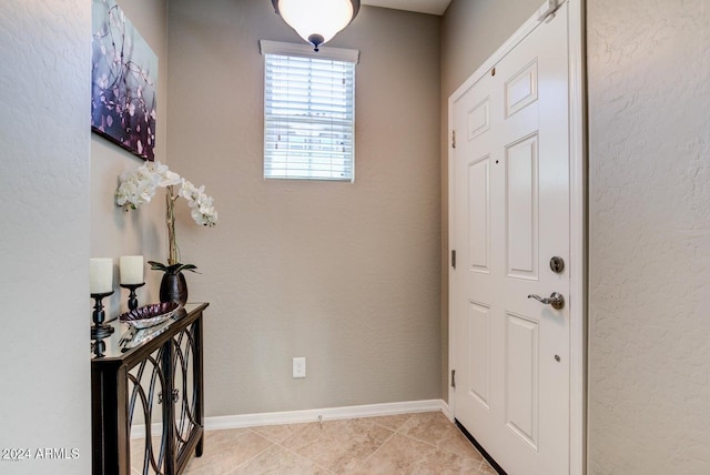 entrance foyer with light tile patterned floors