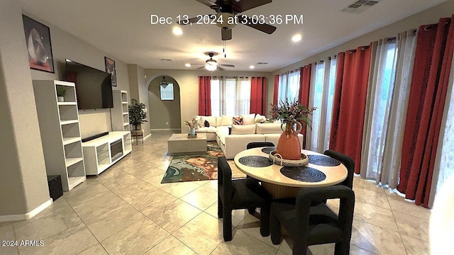 tiled dining area featuring ceiling fan