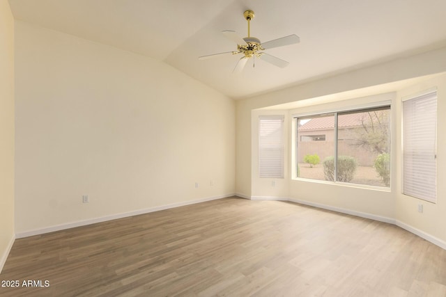 22319 N Desperado Dr, Sun City West, AZ 85375 - spare room with light wood-style flooring, baseboards, a ceiling fan, and lofted ceiling