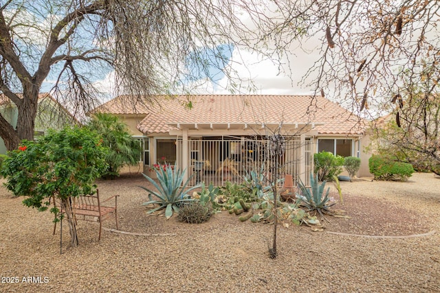 22319 N Desperado Dr, Sun City West, AZ 85375 - rear view of property featuring a tile roof and stucco siding