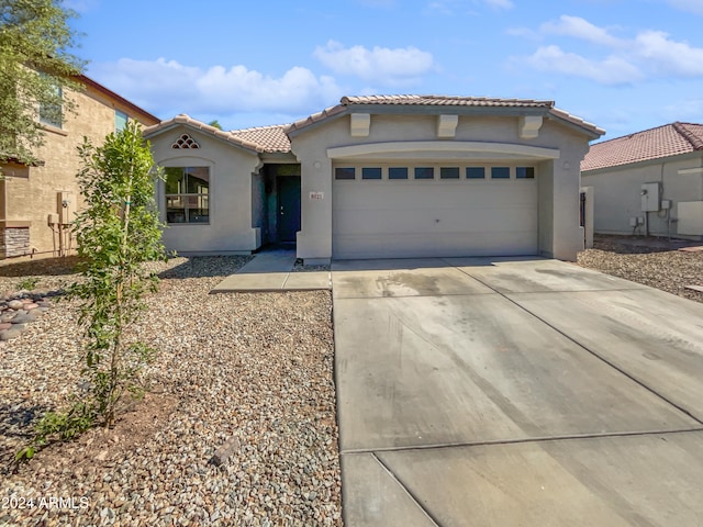 mediterranean / spanish-style house featuring a garage