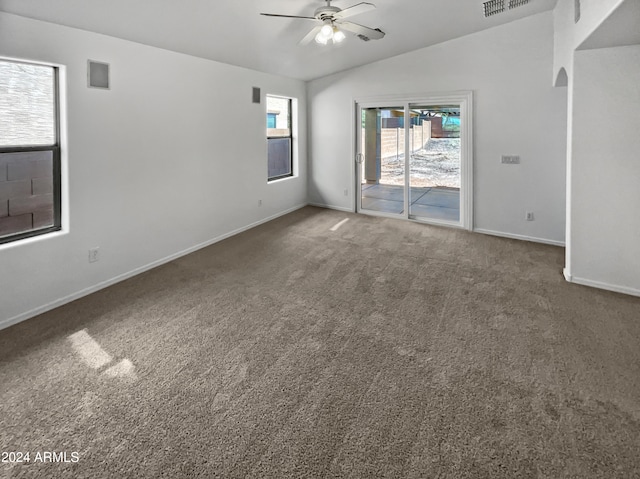 spare room with lofted ceiling, carpet flooring, and ceiling fan