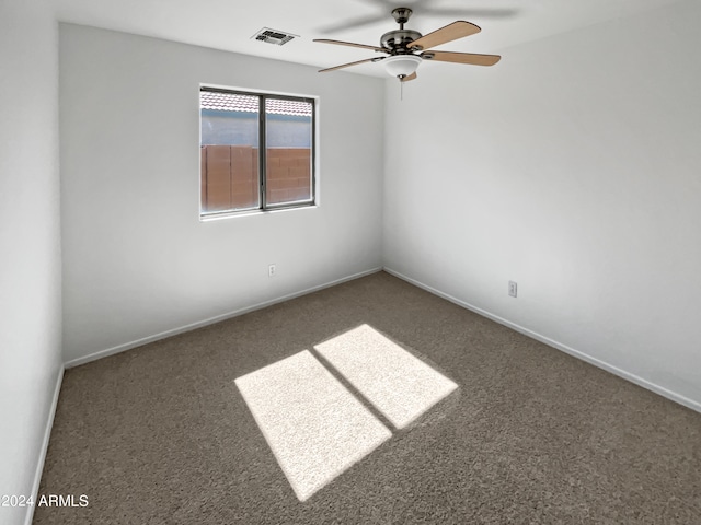 carpeted empty room with ceiling fan