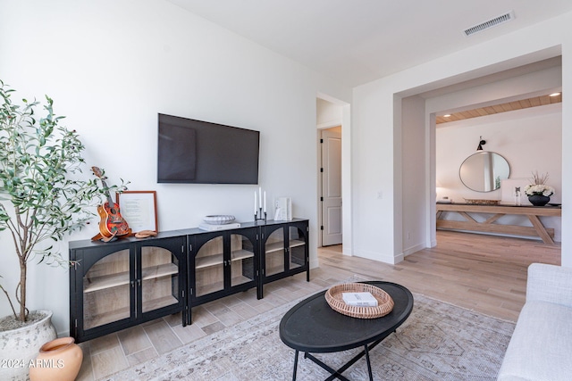 living room with light hardwood / wood-style flooring