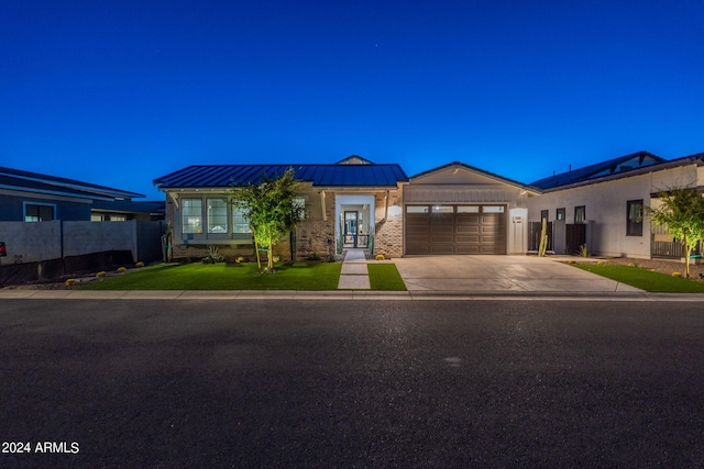 view of front of property featuring a garage