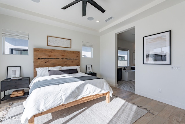 bedroom with light hardwood / wood-style flooring and ceiling fan