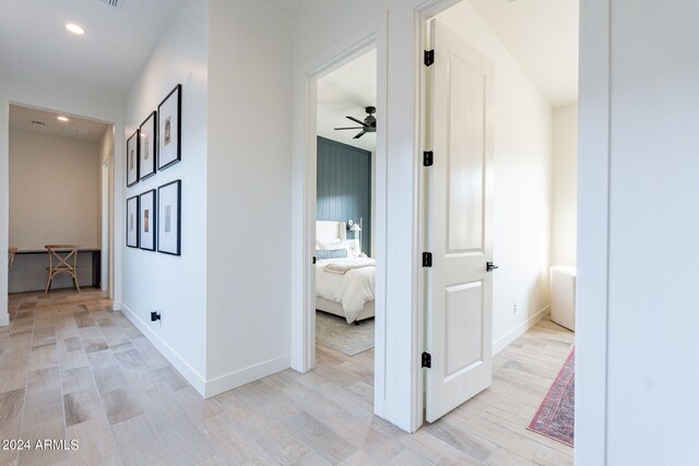 corridor with light wood-type flooring