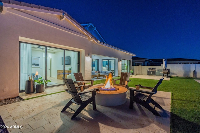 view of patio featuring area for grilling and an outdoor fire pit