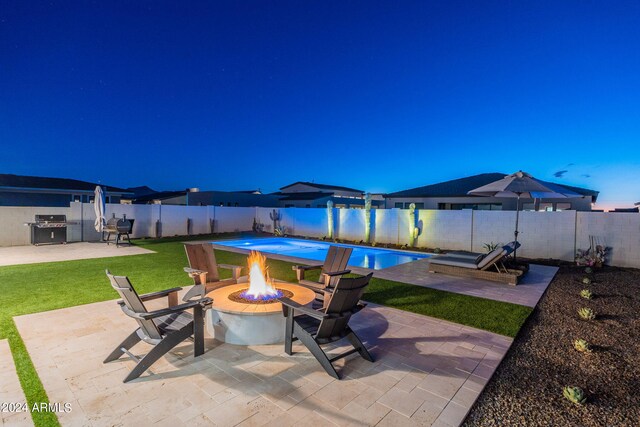 view of patio / terrace featuring grilling area and a fire pit