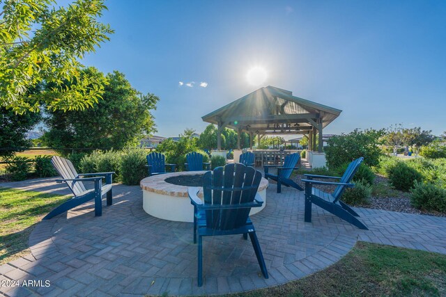 view of patio with a gazebo and an outdoor fire pit