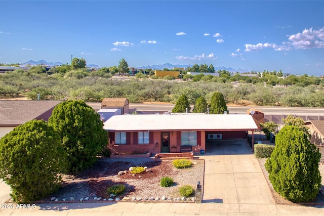 single story home with a carport and a mountain view