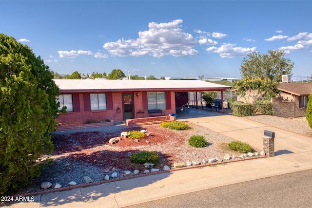 single story home featuring a carport