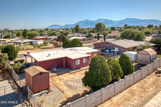 birds eye view of property with a mountain view