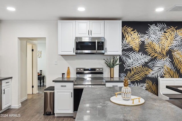 3814 N 36th St, Phoenix, AZ 85018 - kitchen with stainless steel appliances, white cabinets, recessed lighting, and dark wood finished floors