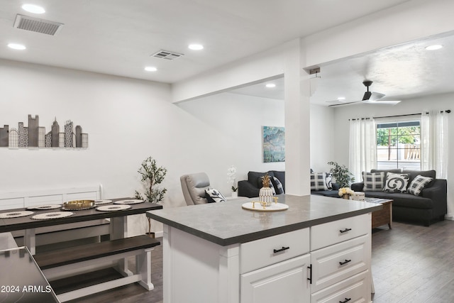 3814 N 36th St, Phoenix, AZ 85018 - kitchen featuring open floor plan, wood finished floors, dark countertops, white cabinetry, and recessed lighting