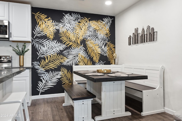 3814 N 36th St, Phoenix, AZ 85018 - unfurnished dining area featuring dark wood-type flooring and recessed lighting