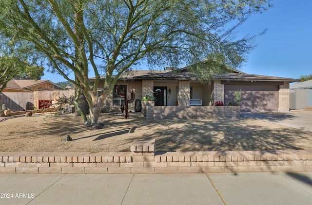 ranch-style home featuring a garage