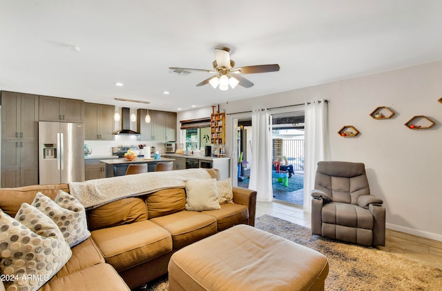 living room with ceiling fan and light wood-type flooring