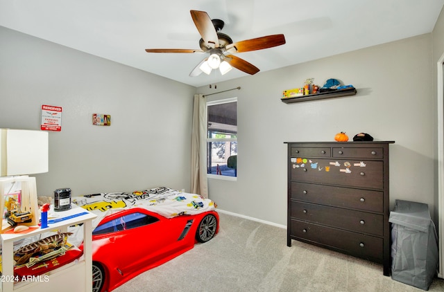 bedroom with light carpet and ceiling fan