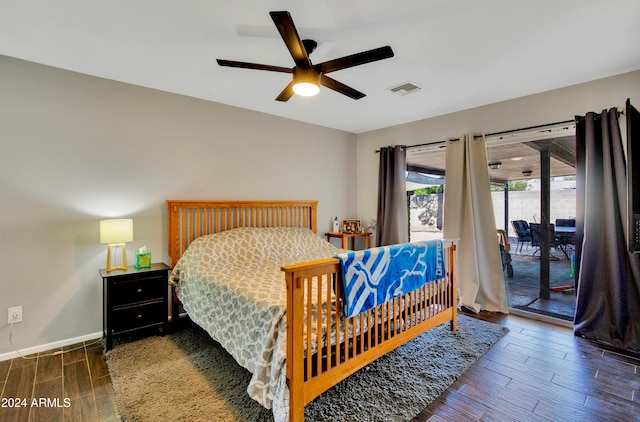 bedroom with access to exterior, ceiling fan, and dark hardwood / wood-style flooring