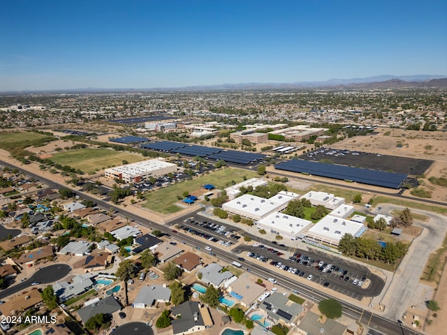 birds eye view of property featuring a mountain view