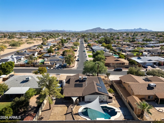 birds eye view of property featuring a mountain view