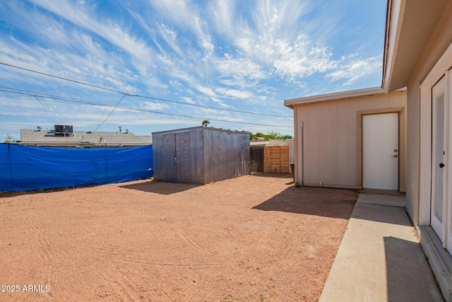 view of yard with an outbuilding and a storage shed