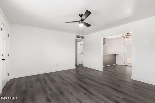 unfurnished bedroom featuring baseboards, dark wood finished floors, and visible vents