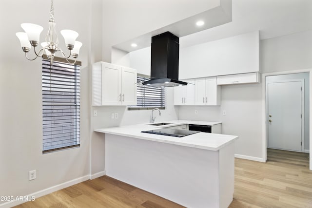 3326 E Calypso Ave, Mesa, AZ 85204 - kitchen featuring baseboards, a peninsula, a sink, and island exhaust hood