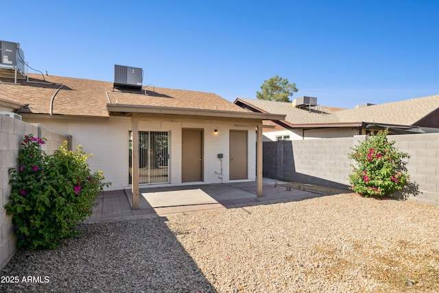 3326 E Calypso Ave, Mesa, AZ 85204 - back of property featuring a fenced backyard, a shingled roof, and a patio