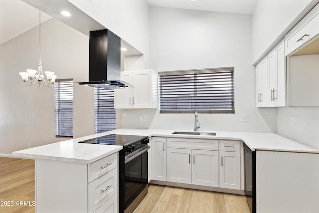 3326 E Calypso Ave, Mesa, AZ 85204 - kitchen featuring a sink, a peninsula, light wood-style flooring, island range hood, and electric range
