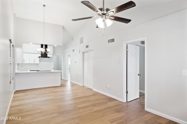 3326 E Calypso Ave, Mesa, AZ 85204 - unfurnished living room featuring visible vents, baseboards, ceiling fan with notable chandelier, and a sink