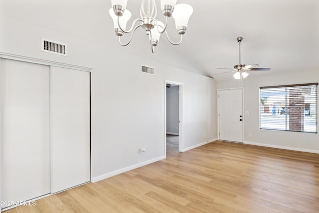 3326 E Calypso Ave, Mesa, AZ 85204 - interior space featuring light wood-type flooring, visible vents, lofted ceiling, and ceiling fan with notable chandelier