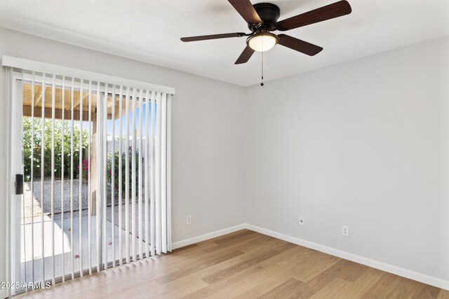 3326 E Calypso Ave, Mesa, AZ 85204 - unfurnished room featuring ceiling fan, baseboards, and wood finished floors