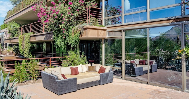 view of patio / terrace featuring an outdoor hangout area and a balcony