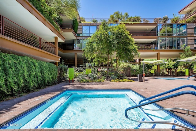 view of pool featuring a patio