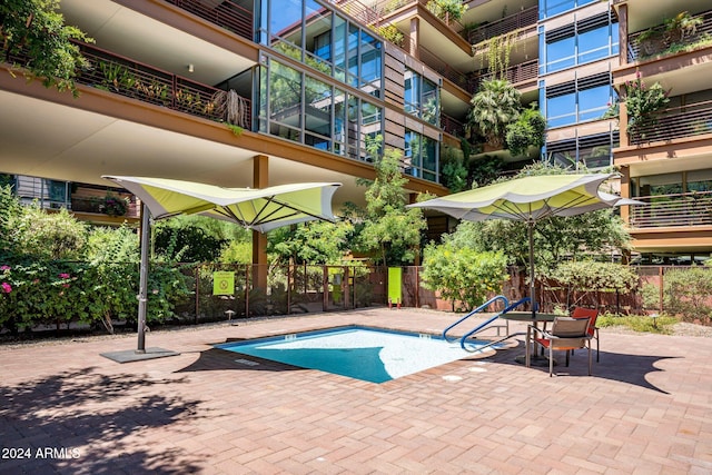 view of swimming pool featuring a patio area