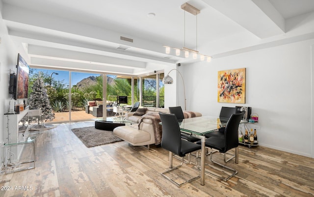 dining space with wood-type flooring