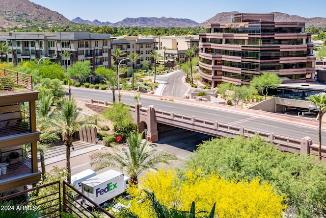 birds eye view of property with a mountain view