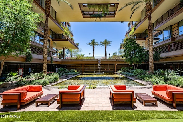 view of patio featuring an outdoor living space and a balcony