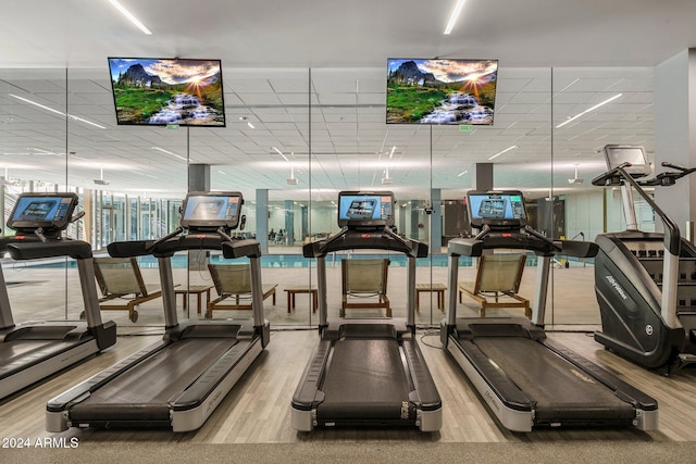 gym with wood-type flooring