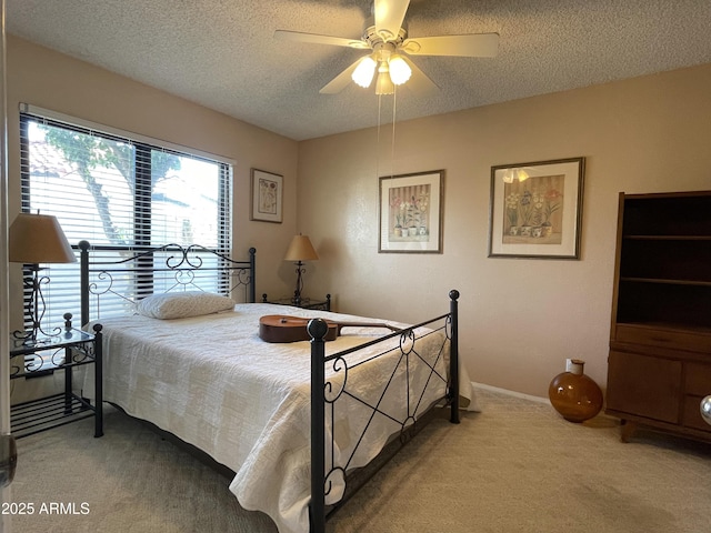 15240 N 51st St, Scottsdale, AZ 85254 - carpeted bedroom featuring baseboards, a ceiling fan, and a textured ceiling